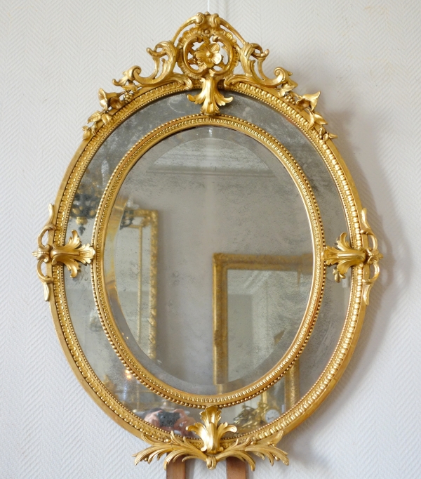 Miroir ovale à parecloses en bois doré, glaces au mercure, époque Napoleon III