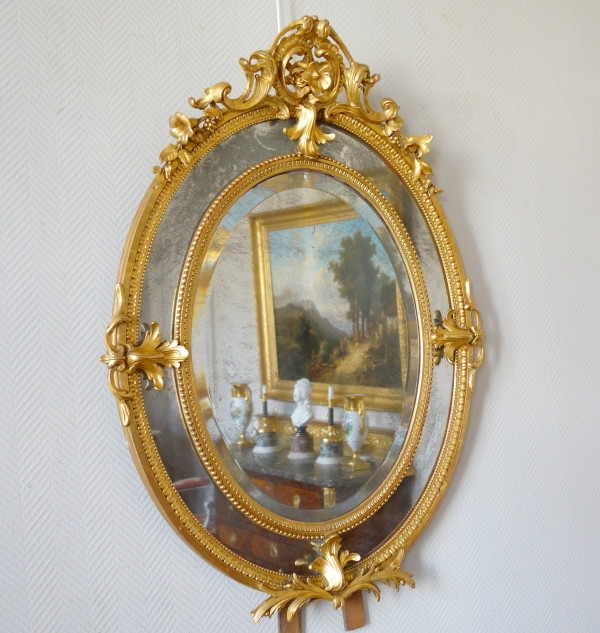 Gold leaf gilt wood oval mirror, mercury mirror, Napoleon III production