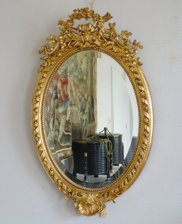 Grand miroir ovale de style Louis XVI en bois doré à la feuille d'or époque Napoléon III - 95,5cm x 60cm