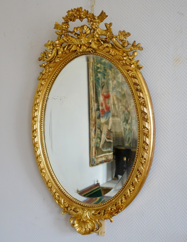 Grand miroir ovale de style Louis XVI en bois doré à la feuille d'or époque Napoléon III - 95,5cm x 60cm