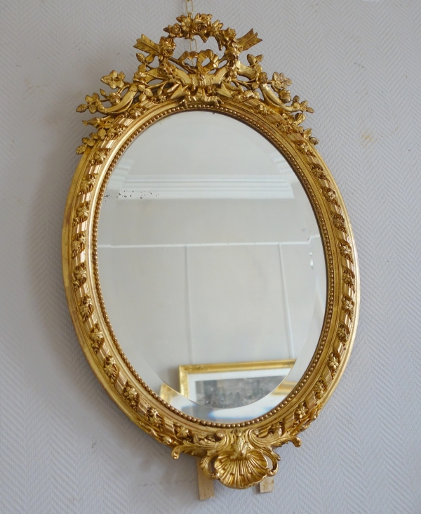 Grand miroir ovale de style Louis XVI en bois doré à la feuille d'or époque Napoléon III - 95,5cm x 60cm