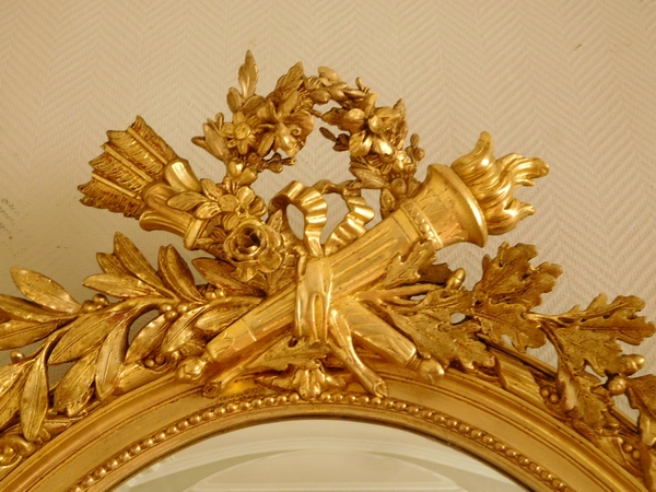 Grand miroir ovale de style Louis XVI en bois doré à la feuille d'or époque Napoleon III - 119cm x 79cm