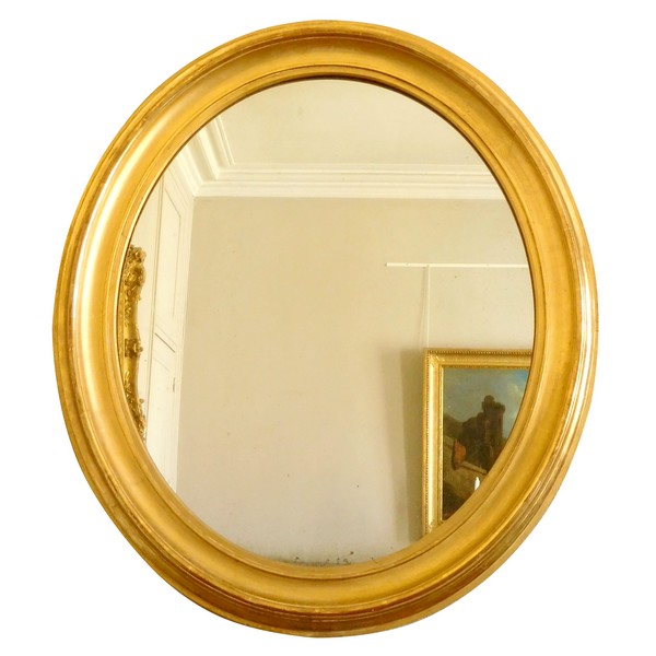 Miroir ovale en bois doré à la feuille d'or, glace au mercure, d'époque XIXe - 80cm x 67cm