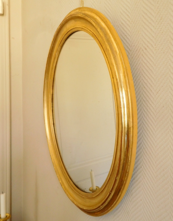 Miroir ovale en bois doré à la feuille d'or, glace au mercure, d'époque XIXe - 80cm x 67cm