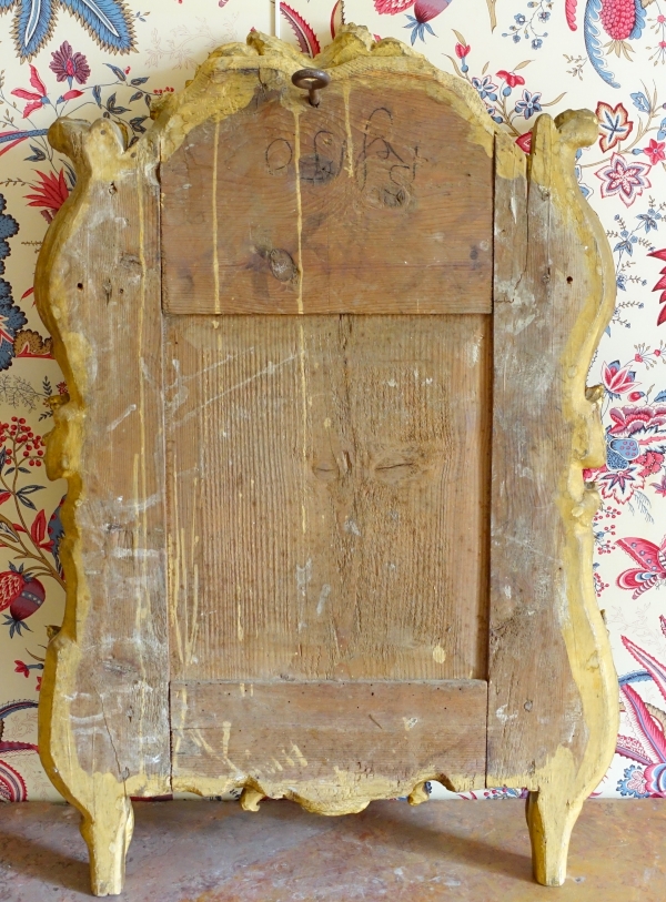 Miroir en bois doré, glace au mercure, travail Provencal d'époque Louis XV - Transition