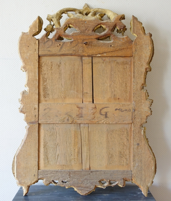 Grand miroir provençal d'époque Louis XV en bois doré richement sculpté, glace au mercure