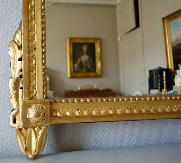 Tall Louis XVI mirror, music trophy patterned frame gilt with gold leaf - late 18th century