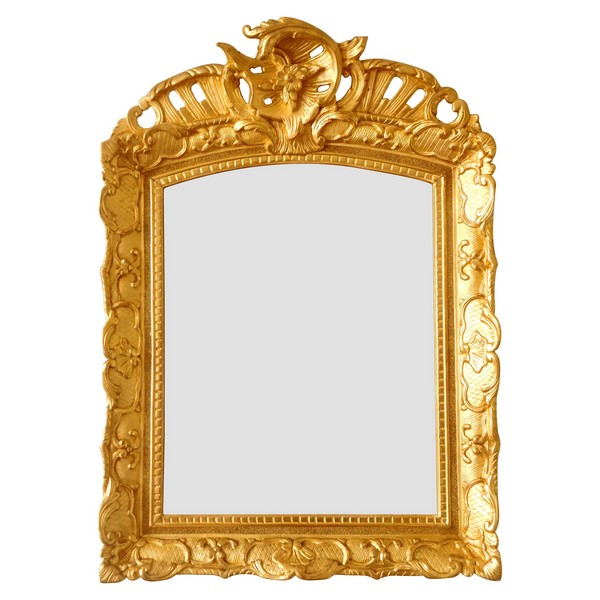 Miroir en bois doré d'époque Régence, glace biseautée