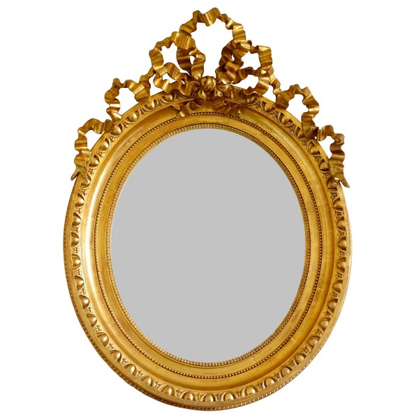 Tall Louis XVI style gilt wood oval mirror, Napoleon III period - 77cm x 104cm