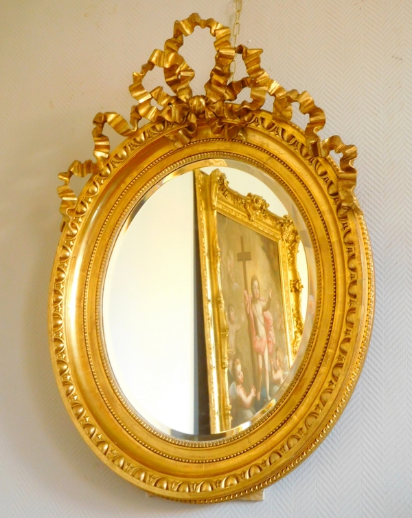 Tall Louis XVI style gilt wood oval mirror, Napoleon III period - 77cm x 104cm