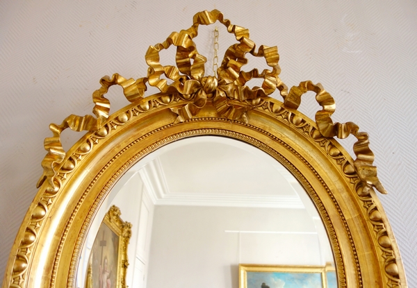 Tall Louis XVI style gilt wood oval mirror, Napoleon III period - 77cm x 104cm