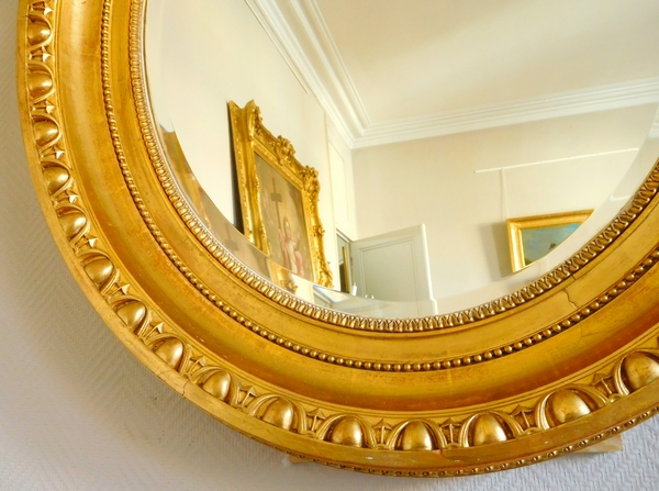 Tall Louis XVI style gilt wood oval mirror, Napoleon III period - 77cm x 104cm