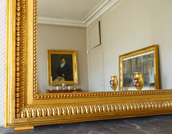 Miroir de cheminée / à suspendre de style Louis XVI en bois doré décor noeud ruban 82cm x 127cm