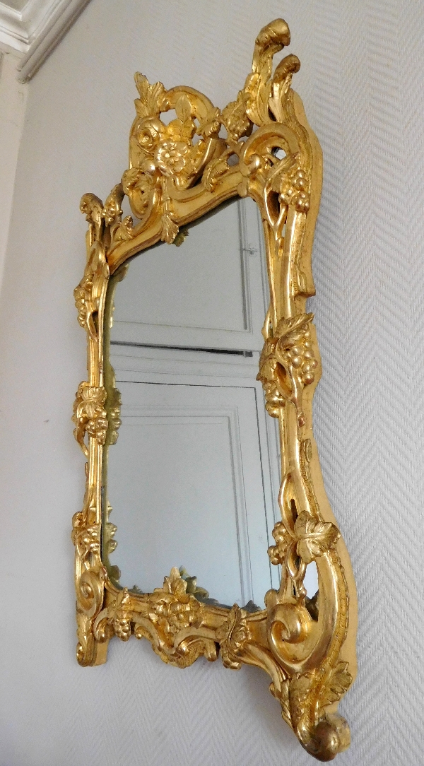 Miroir en bois doré, glace au mercure, travail Provencal d'époque Louis XV - Transition