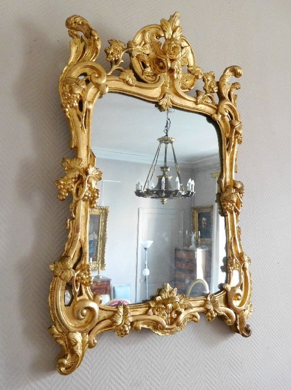 Miroir en bois doré, glace au mercure, travail Provencal d'époque Louis XV - Transition