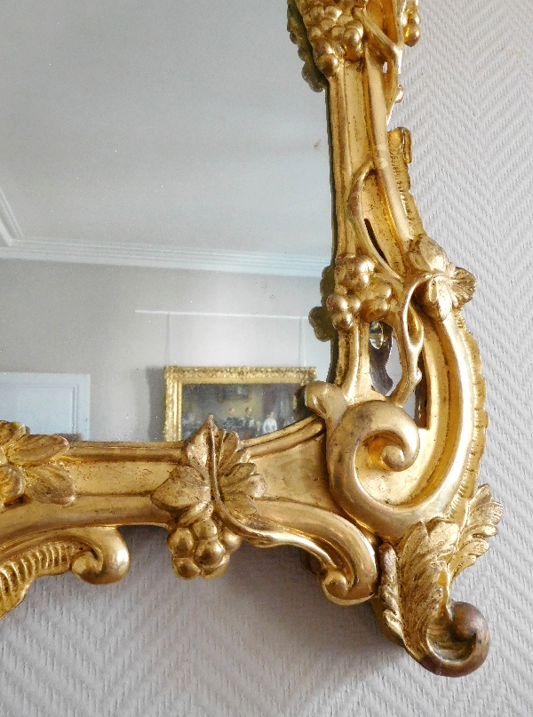 Miroir en bois doré, glace au mercure, travail Provencal d'époque Louis XV - Transition