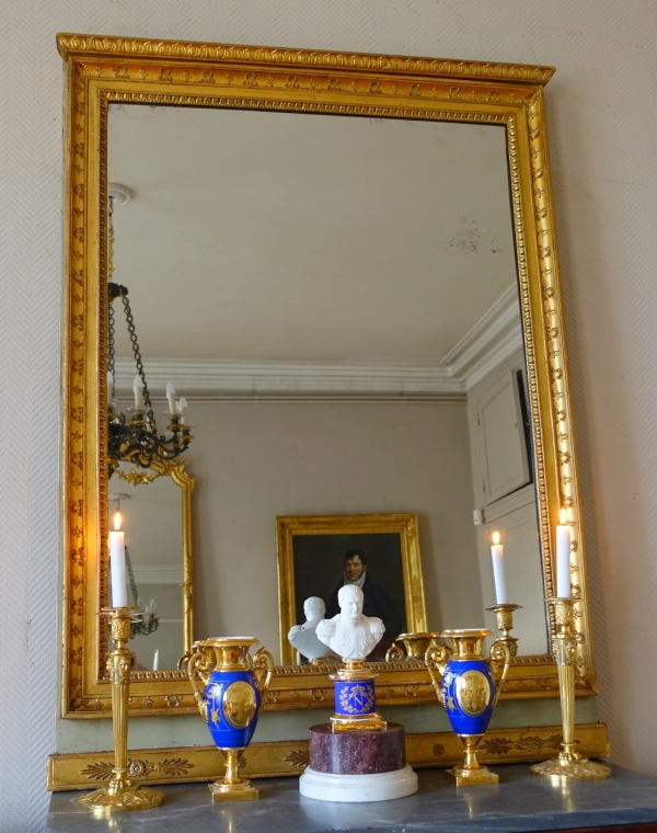 Trumeau, miroir de boiserie d'époque Empire en bois laqué et doré, glace au mercure