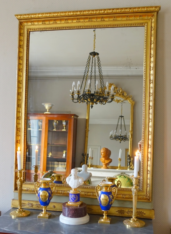 Trumeau, miroir de boiserie d'époque Empire en bois laqué et doré, glace au mercure