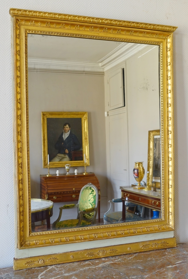 Trumeau, miroir de boiserie d'époque Empire en bois laqué et doré, glace au mercure