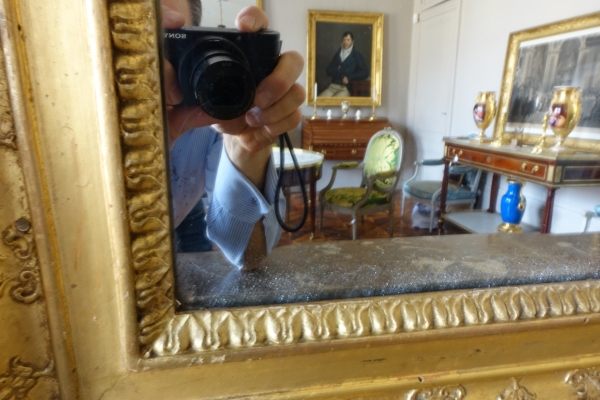 Trumeau, miroir de boiserie d'époque Empire en bois laqué et doré, glace au mercure