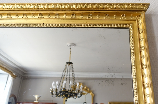 Trumeau, miroir de boiserie d'époque Empire en bois laqué et doré, glace au mercure