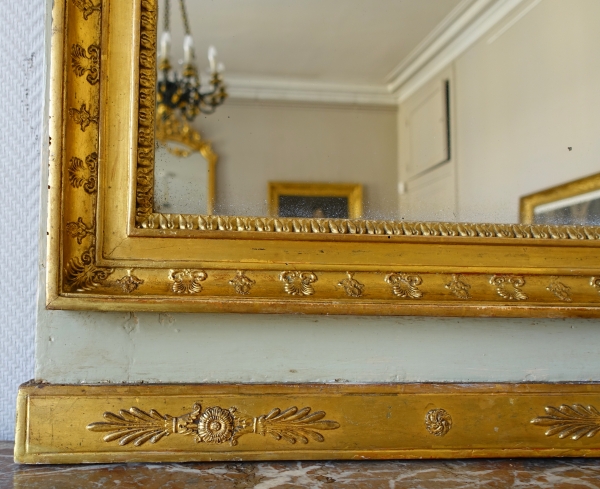 Trumeau, miroir de boiserie d'époque Empire en bois laqué et doré, glace au mercure