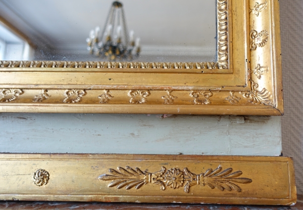 Trumeau, miroir de boiserie d'époque Empire en bois laqué et doré, glace au mercure