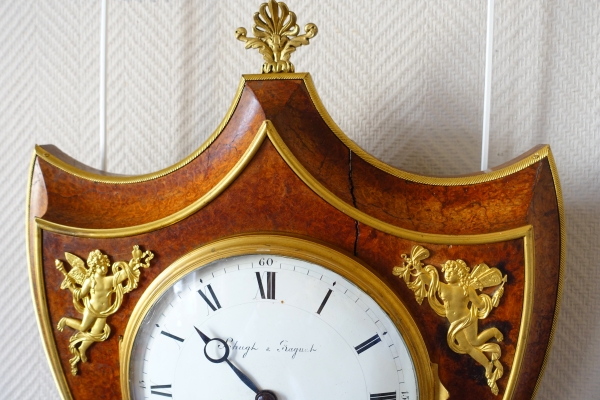 Empire burl thuja and ormolu crest-shaped clock, early 19th century