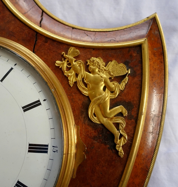 Empire burl thuja and ormolu crest-shaped clock, early 19th century