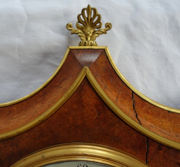 Empire burl thuja and ormolu crest-shaped clock, early 19th century