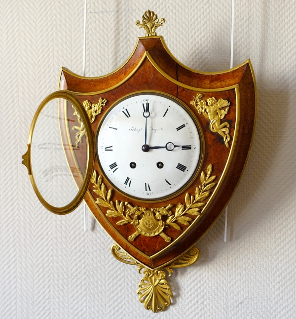 Empire burl thuja and ormolu crest-shaped clock, early 19th century