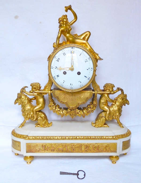 Louis XVI style ormolu and marble clock, bacchante and goats