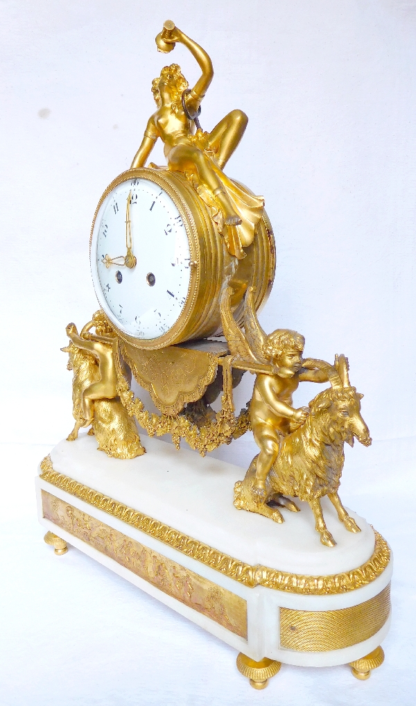 Louis XVI style ormolu and marble clock, bacchante and goats