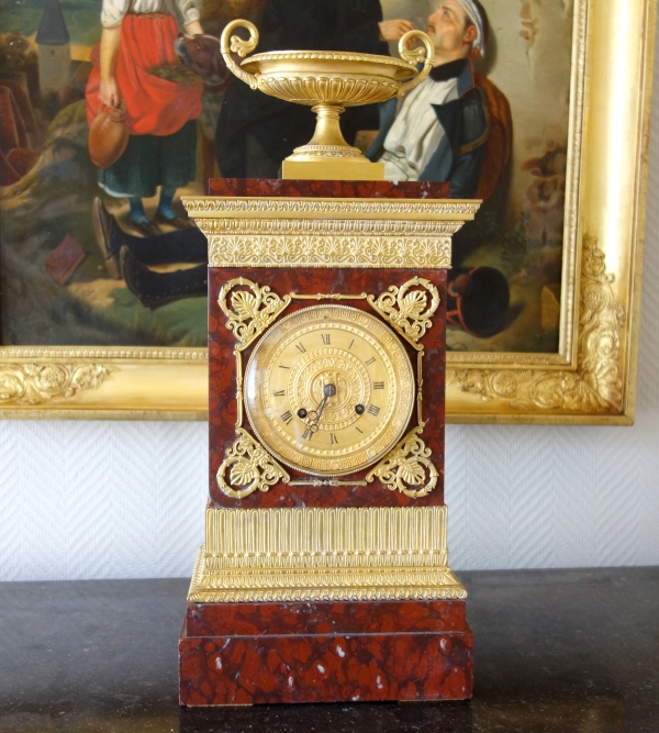 Tall ormolu and red marble Empire clock, early 19th century circa 1815-1820