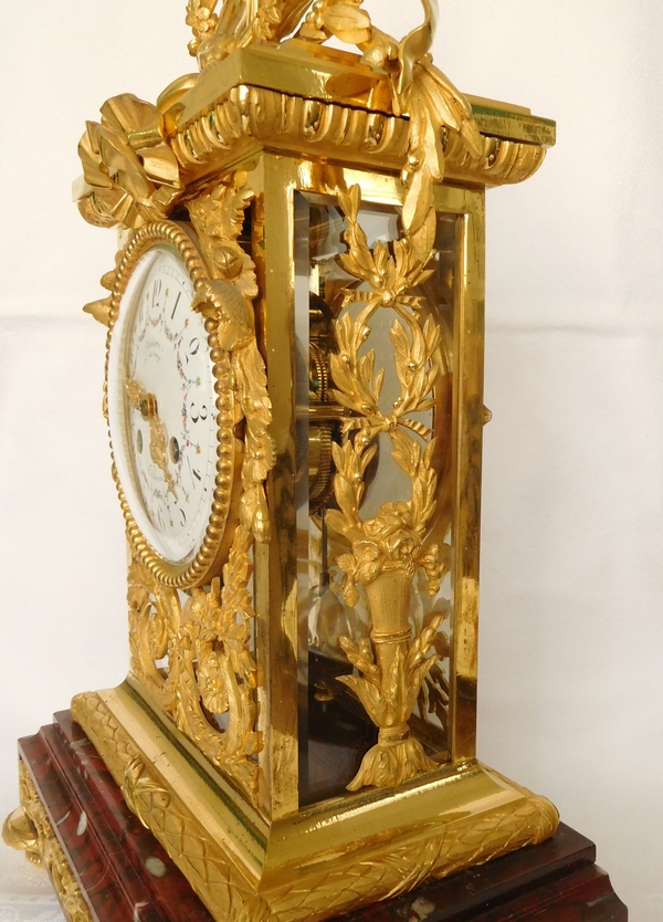 Pendule cage de style Louis XVI en bronze ciselé et doré et marbre griotte, époque XIXe