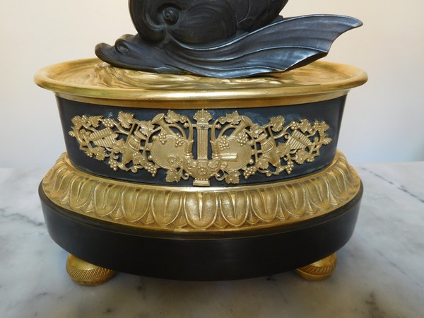 Empire clock, ormolu and patinated bronze, dolphin and putti, 19th century (circa 1820)