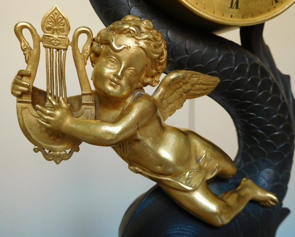 Empire clock, ormolu and patinated bronze, dolphin and putti, 19th century (circa 1820)