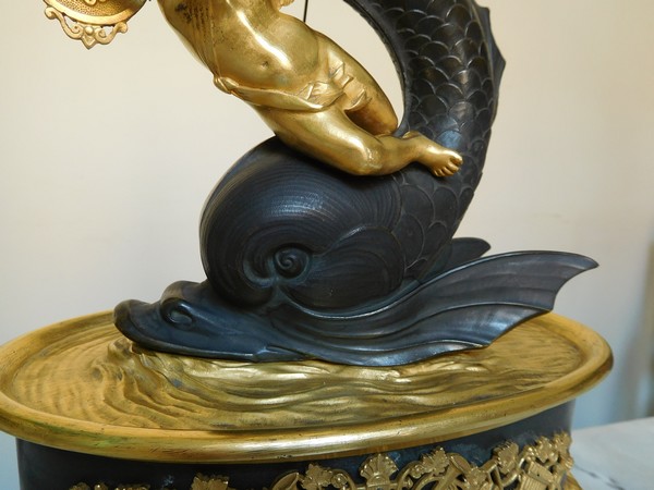 Empire clock, ormolu and patinated bronze, dolphin and putti, 19th century (circa 1820)