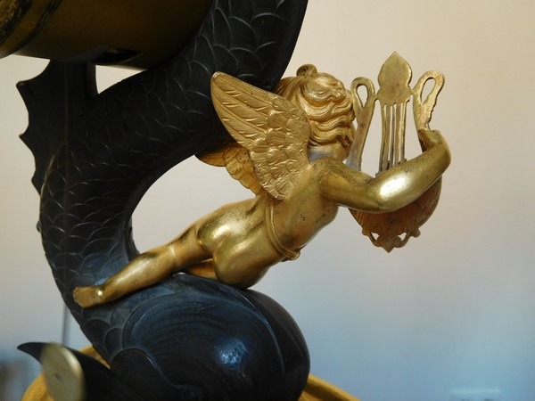 Empire clock, ormolu and patinated bronze, dolphin and putti, 19th century (circa 1820)