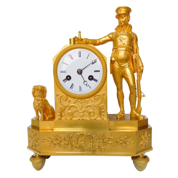 Empire ormolu clock picturing a hunter, early 19th century