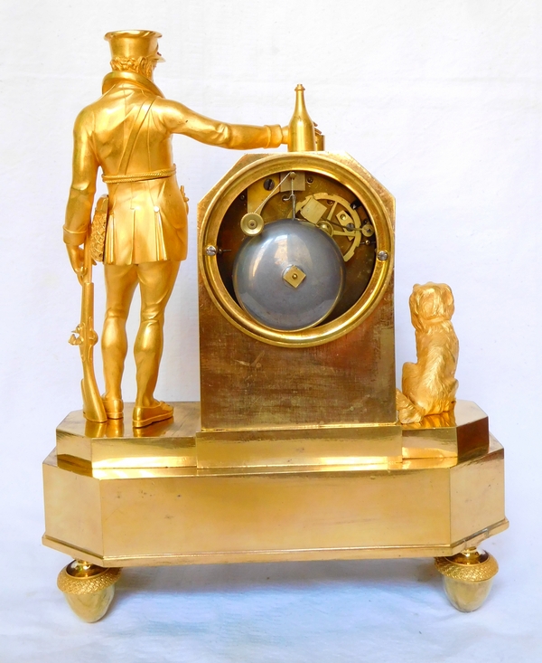 Empire ormolu clock picturing a hunter, early 19th century