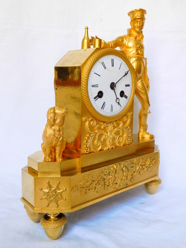 Empire ormolu clock picturing a hunter, early 19th century