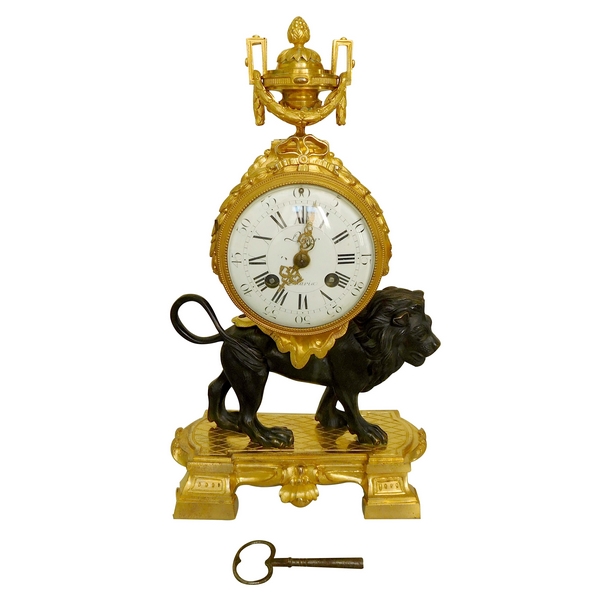 Ormolu and patinated bronze clock picturing a lion, Louis XVI style, 19th century