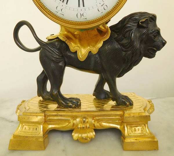 Ormolu and patinated bronze clock picturing a lion, Louis XVI style, 19th century