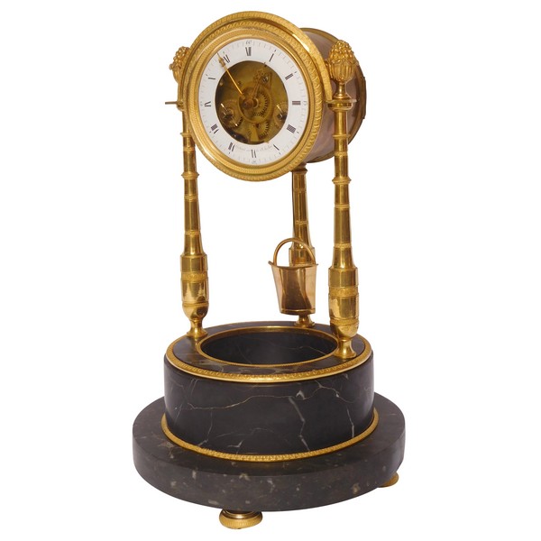 Pendule squelette au puits d'époque Consulat par Cachard - bronze doré et marbre portor