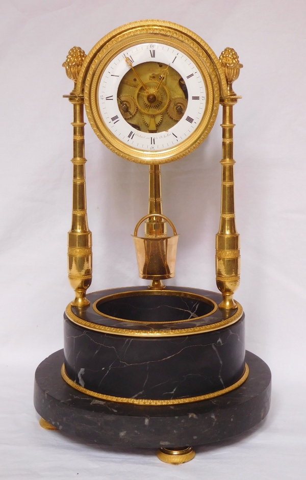 Ormolu and portor marble skeleton clock signed Cachard, late 18th century