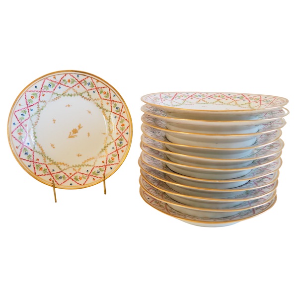 Set of 12 Louis XVI porcelain polychromatic dessert plates enhanced with fine gold, late 18th century