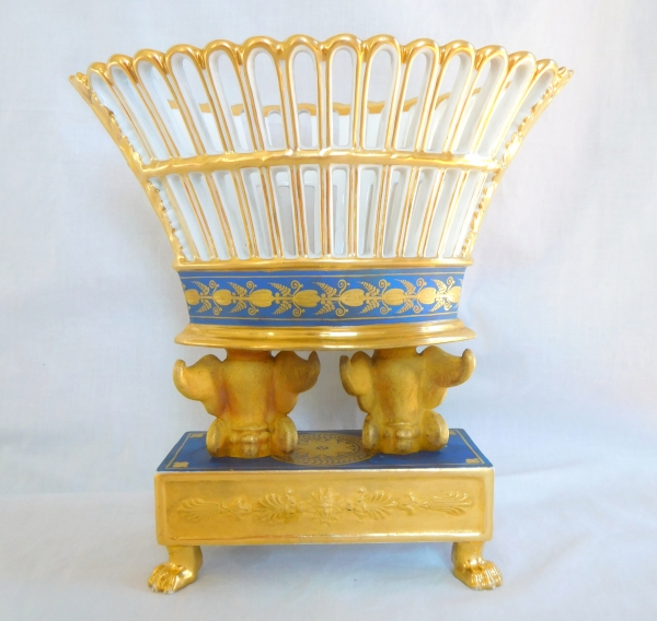 Empire Paris porcelain gilt reticulated cup held by two winged lions, early 19th century