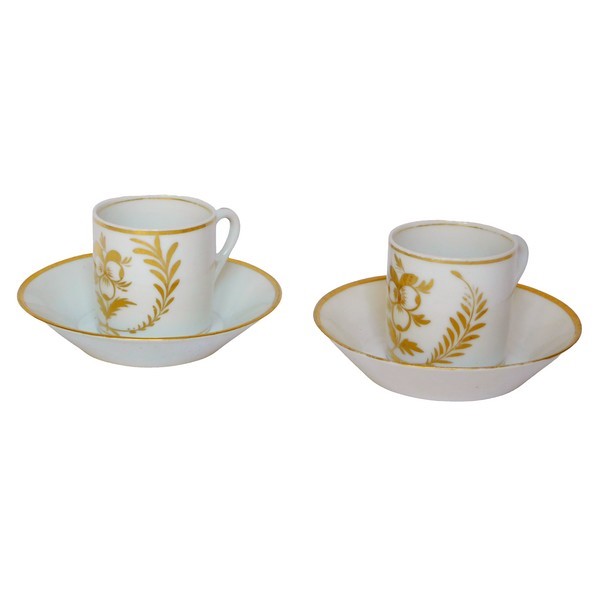 Pair of Empire Paris porcelain coffee cups enhanced with fine gold, early 19th century