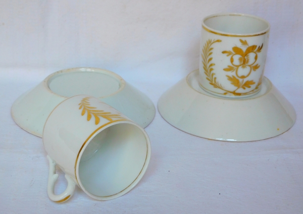 Pair of Empire Paris porcelain coffee cups enhanced with fine gold, early 19th century